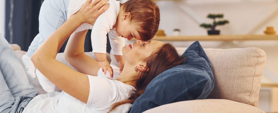 Conception of parenting. Mother with her little daughter is at home together Conception of parenting. Mother with her little daughter is at home together.