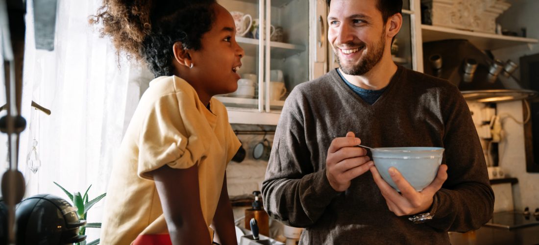 Father talking with his teenager daughter at home